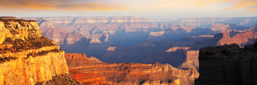 The breathtaking Grand Canyon National Park, an iconic wonder in Arizona. This image captures the awe-inspiring beauty of the vast canyon, with its intricate rock formations.