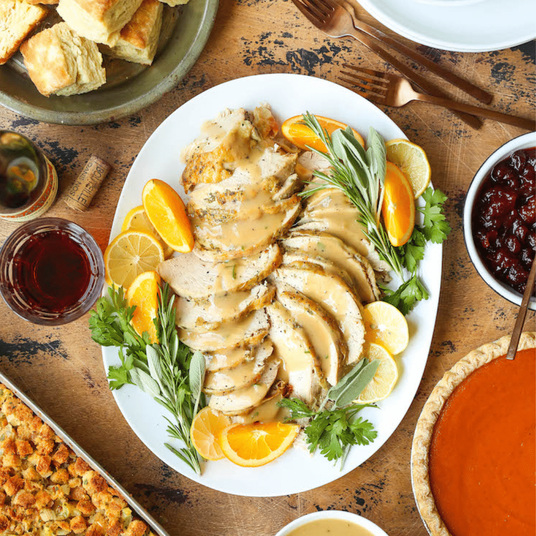 A succulent Slow Cooker Turkey breast beautifully cooked and ready to be served. This dish is an ideal option for travel nurses working on a temporary assignment during Thanksgiving, offering a convenient and delicious meal option to enjoy the holiday spirit away from home.
